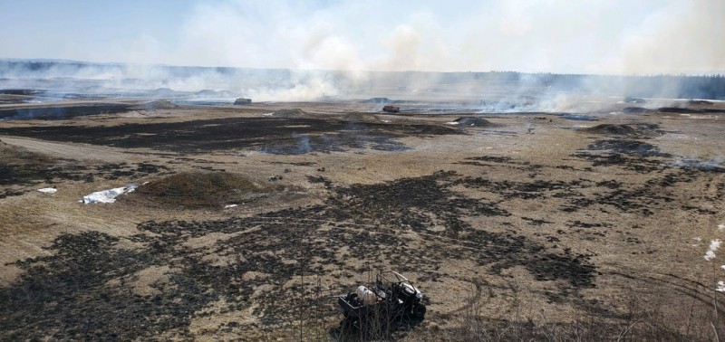 Photo of prescribed burning on a military training range.
