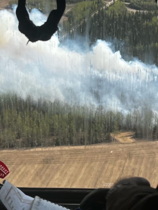 A view of the Barley Way Fire from a helicopter. The fire is burning in timber next to agricultural fields taken during initial attack on May 20.